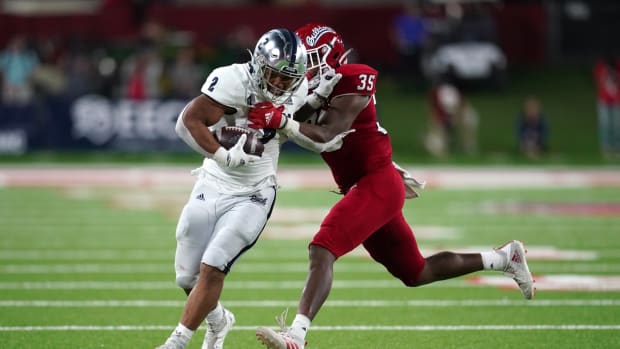 Oct 23, 2021; Fresno, California, USA; Nevada Wolf Pack running back Devonte Lee (2) runs the ball against the Fresno State Bulldogs in the fourth quarter at Bulldog Stadium. Mandatory Credit: Cary Edmondson-USA TODAY Sports